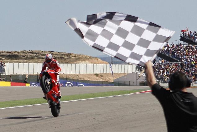 MotoGP Racer with Checkered Flag